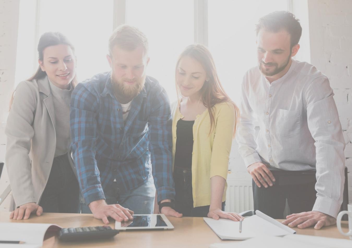 Team reviewing monthly variance reports during financial meeting