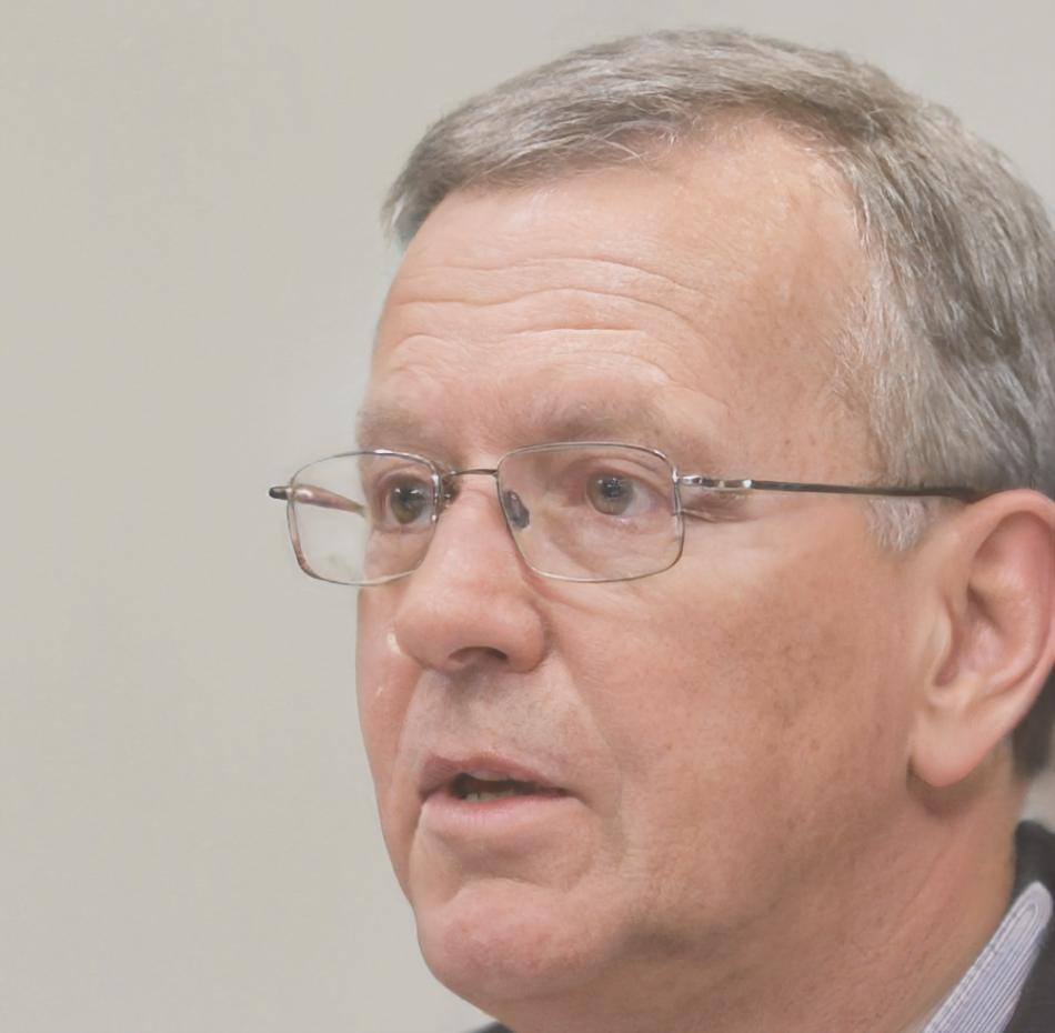 Lead instructor Tomas reviewing variance analysis report with student